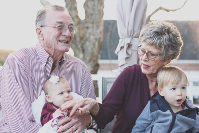 grandpa and grandma with their two grandchildren